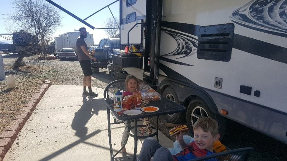 RV family travel stop during a contract
